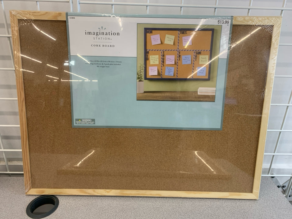NIP FRAMED CORKBOARD.