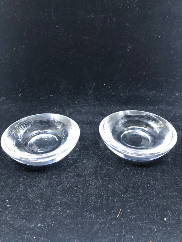 2 THICK CLEAR GLASS CANDLE HOLDERS.