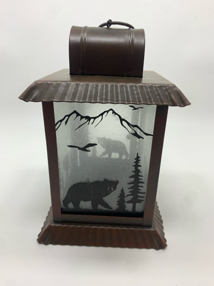 BROWN METAL LANTERN W/BEAR FOREST GLASS.