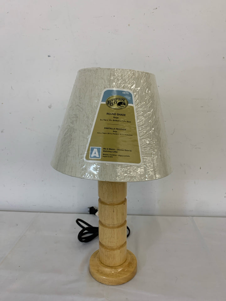 BLONDE WOOD CARVED BASE LAMP W/ NEW SHADE.