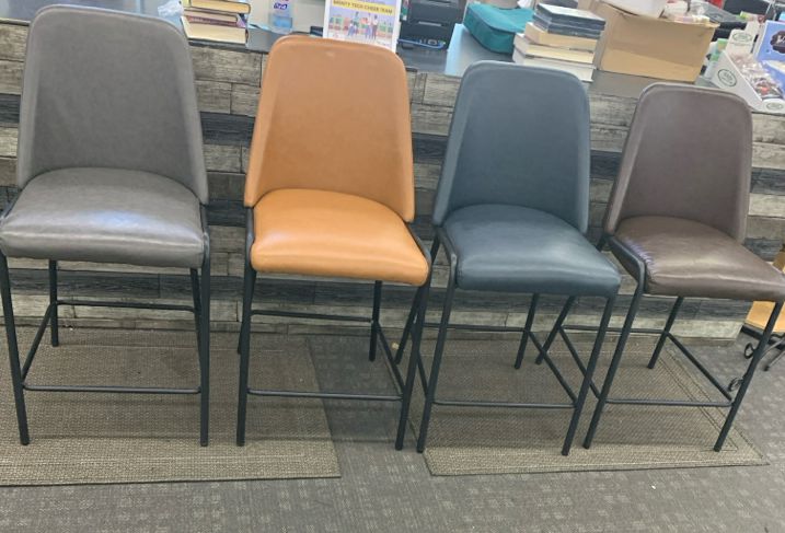 4 COLORFUL FAUX LEATHER BAR STOOLS.