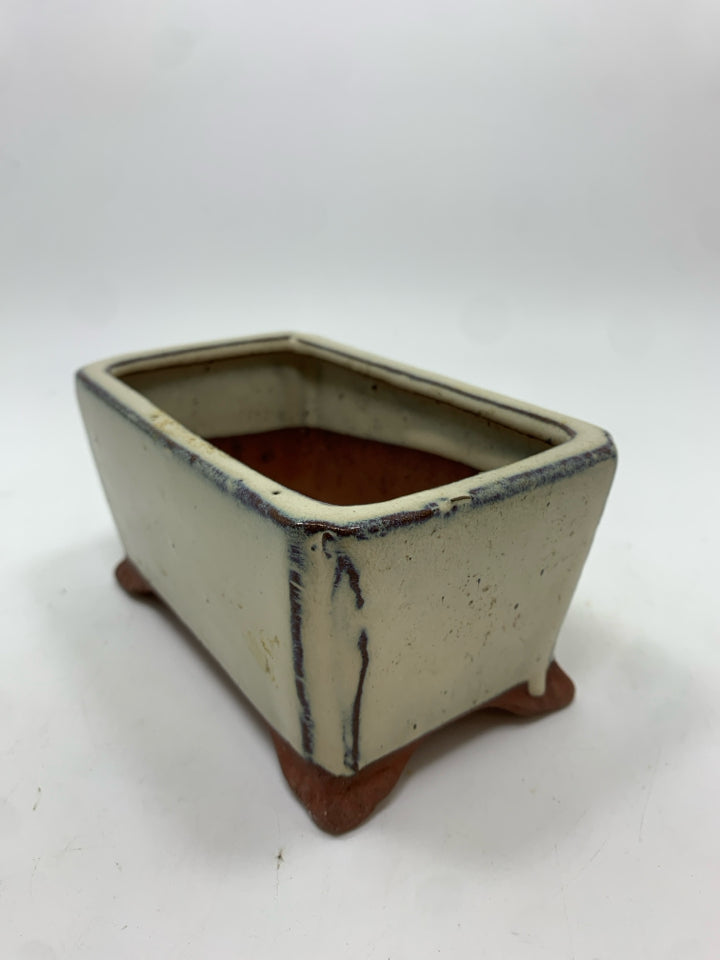 TAN GLAZED TERRACOTTA PLANTER.