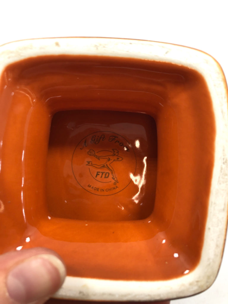 ORANGE PEDESTAL BOWL W/EMBOSSED ACORNS.