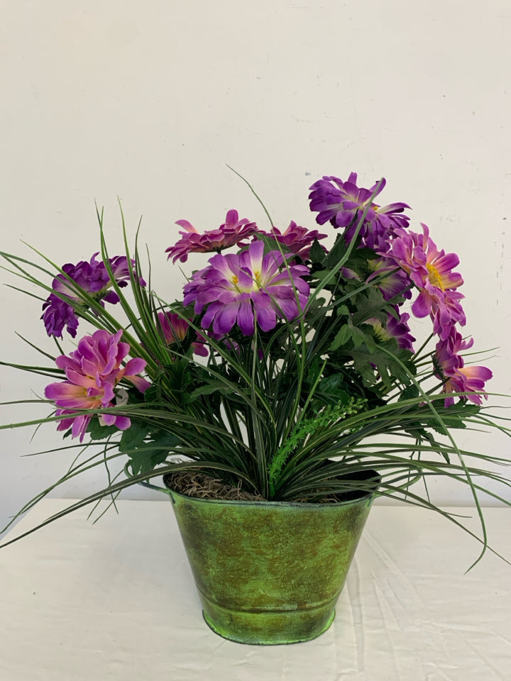 GREEN VASE W/PURPLE FAUX FLOWERS.