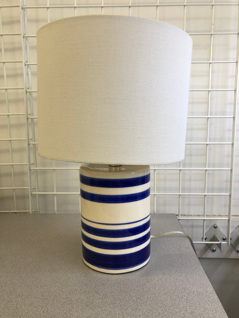 BLUE WHITE STRIPE CERAMIC LAMP W/WHITE SHADE.