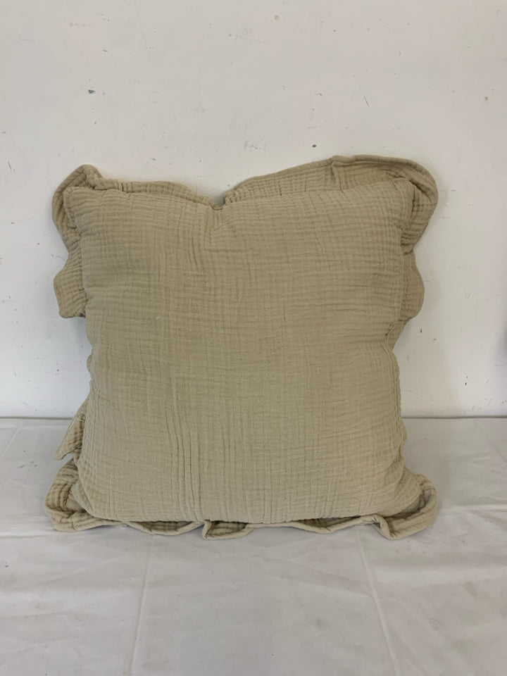 TAN RUFFLED EDGE SQUARE PILLOW.