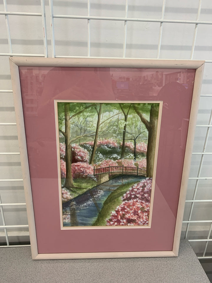 STREAM IN WOODS PAINTING IN PINK FRAME.
