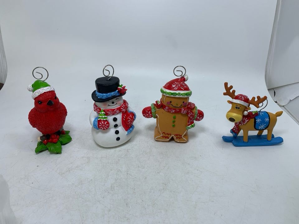 4 RESIN ASSORTED TEMPTATIONS CHARACTERS PHOTO HOLDERS IN BAG.