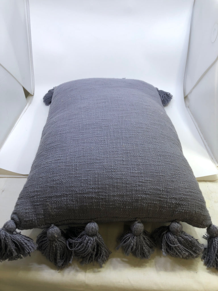 BLUE PILLOW W POM POMS.