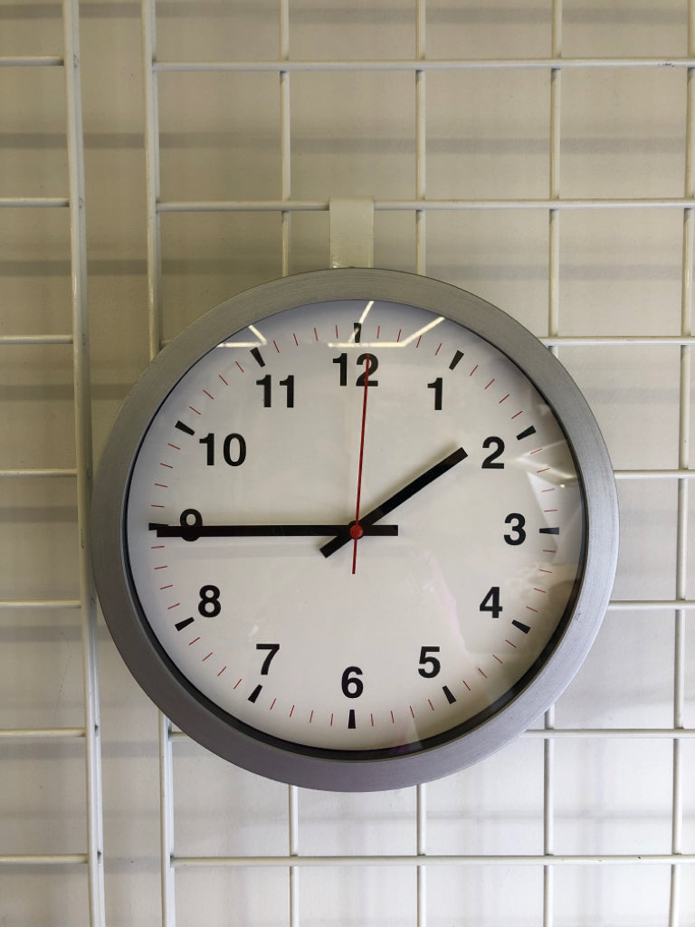 SILVER PLASTIC CLOCK.
