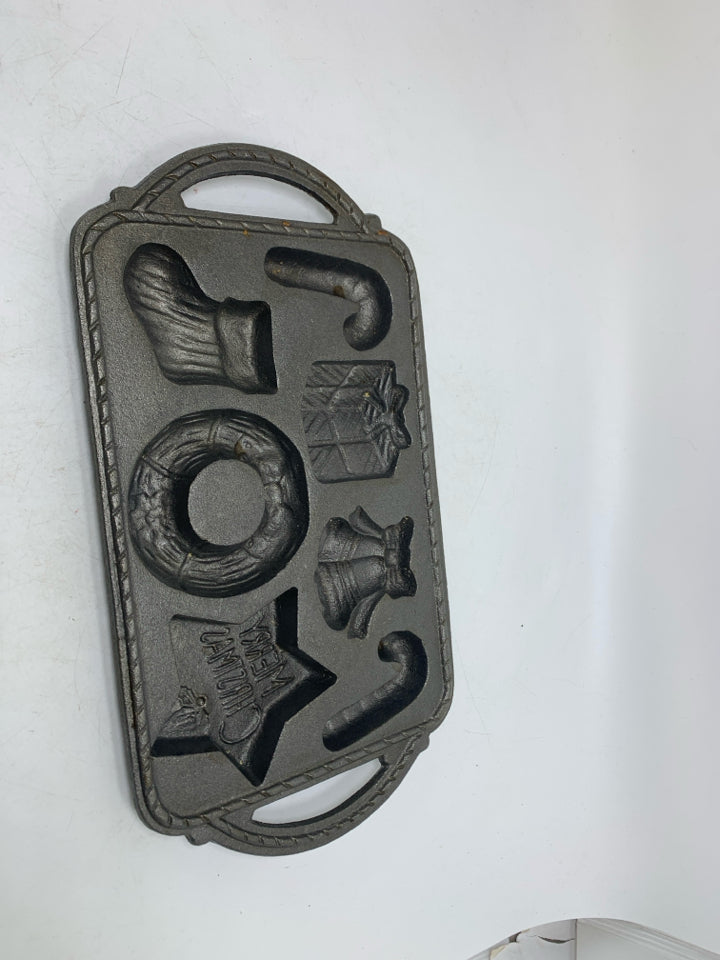 VTG 7 SLOT ASSORTED HOLIDAY THEME CAST IRON BAKING PAN.