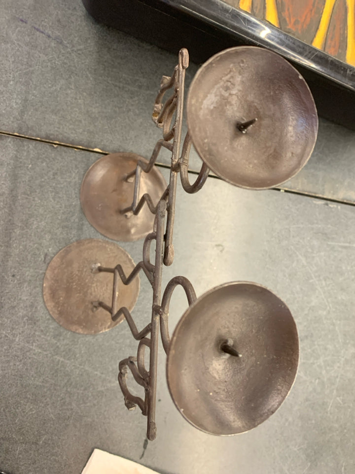 2 BROWN IRON MEN HOLDING FISH CANDLE STICK HOLDERS.