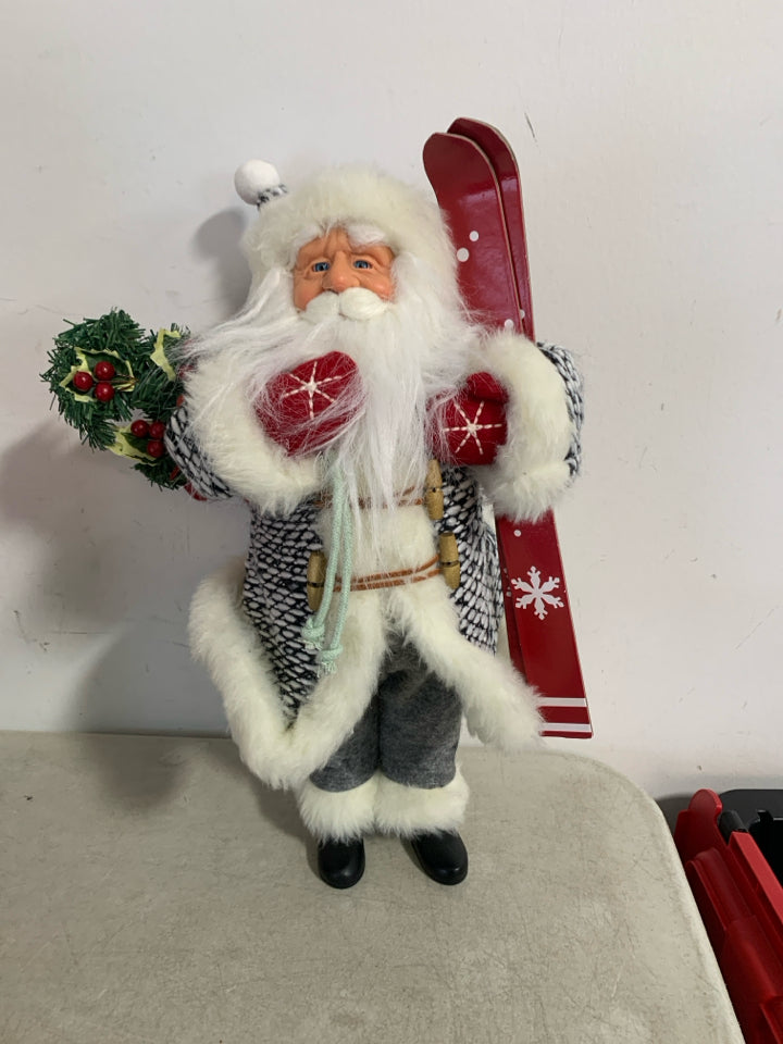 STANDING SANTA W/ SKIS BLACK/WHITE KNIT SUIT.