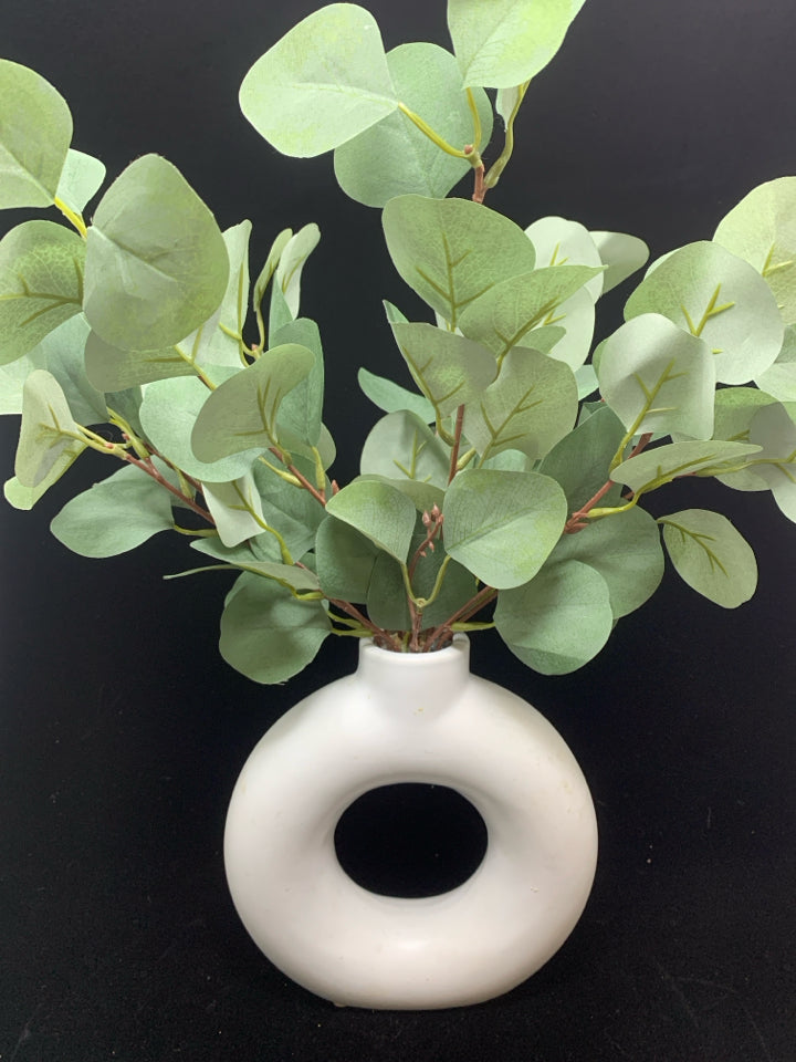 FAUX EUCALYPTUS IN ABSTRACT VASE.