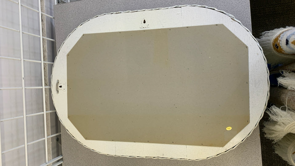 WHITE WICKER OVAL WALL MIRROR.