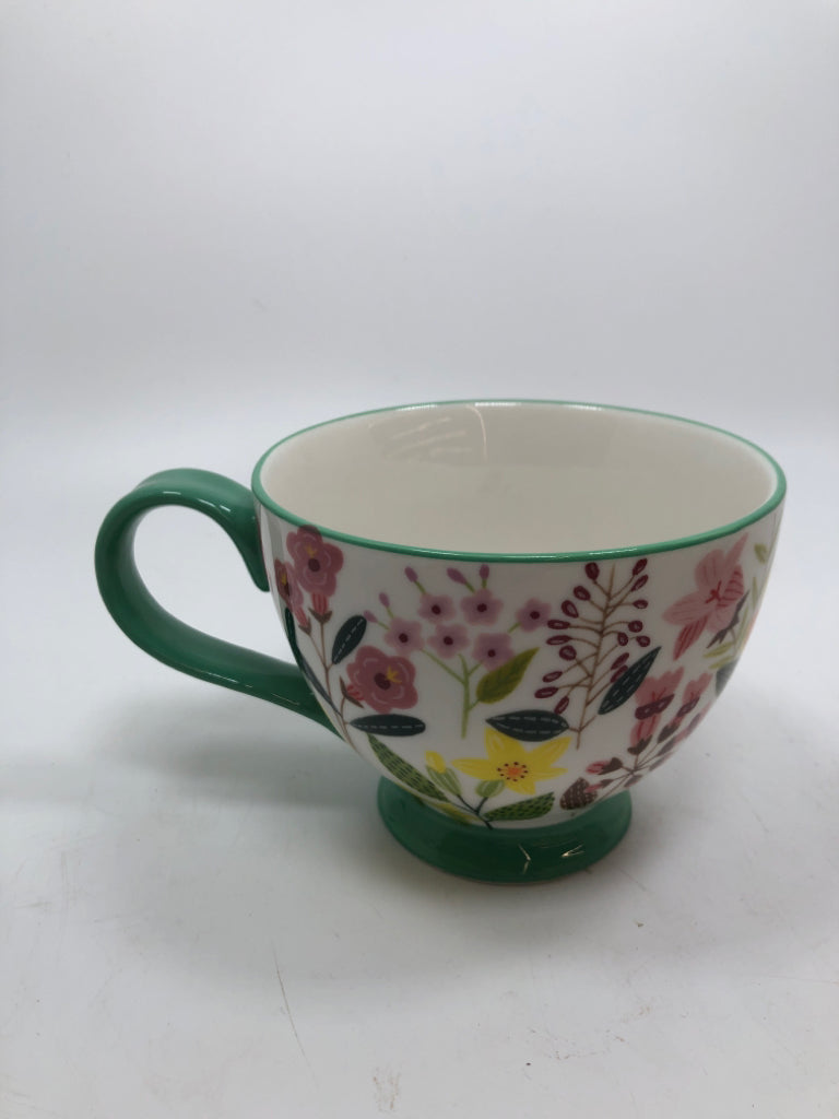 GREEN FLORAL FOOTED MUG.