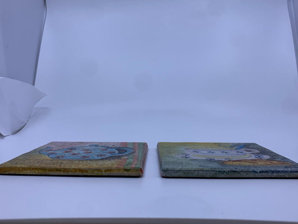 2 TERRA COTTA SPONGED COLORFUL TRIVETS.