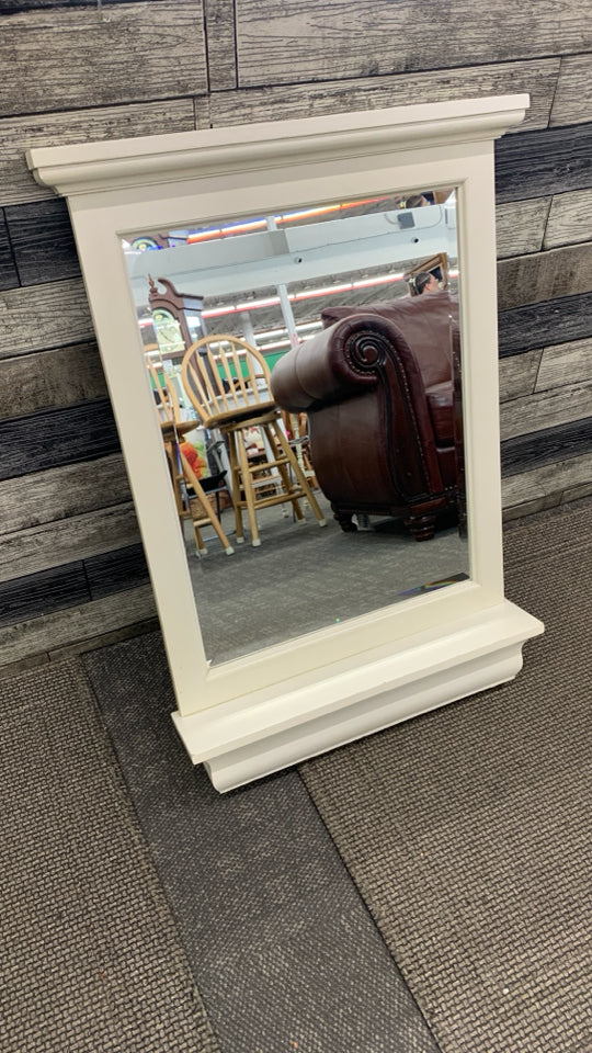 CREAM COLORED MIRROR W/SHELF.
