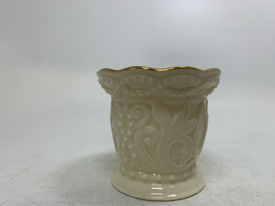 EMBOSSED TEA LIGHT HOLDER.