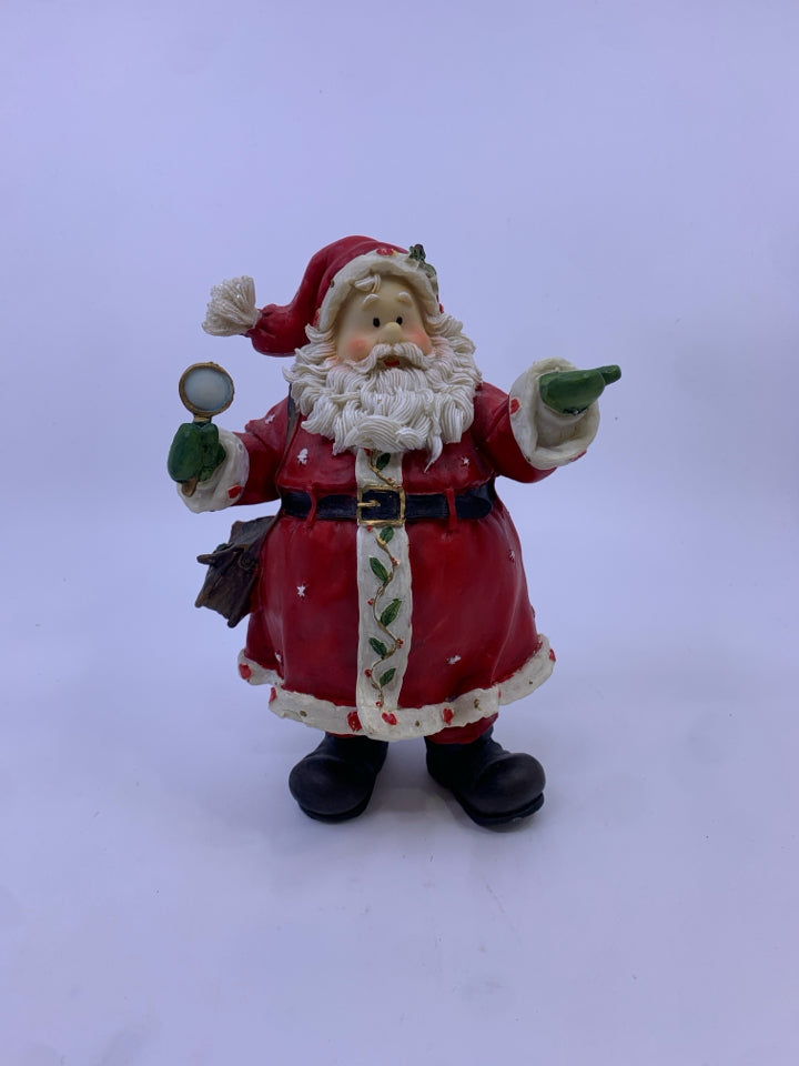 RESIN SANTA HOLDING OUT HIS HAND GREEN MITTEN.