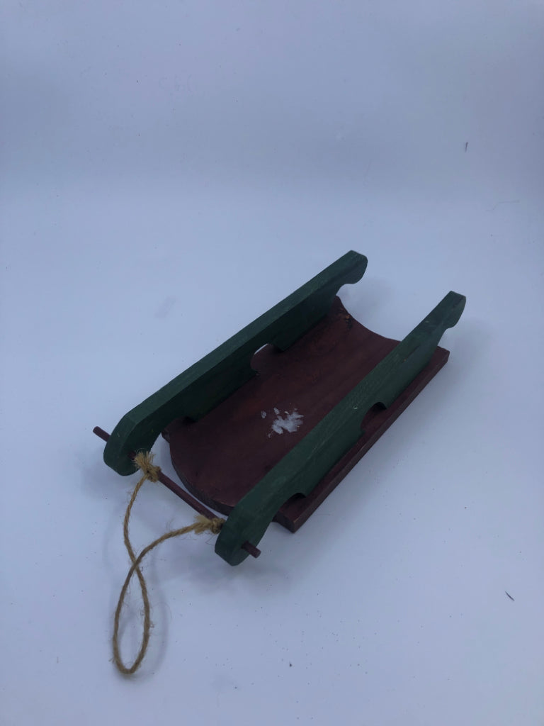 RED/GREEN SNOWMAN HANGING SLED.