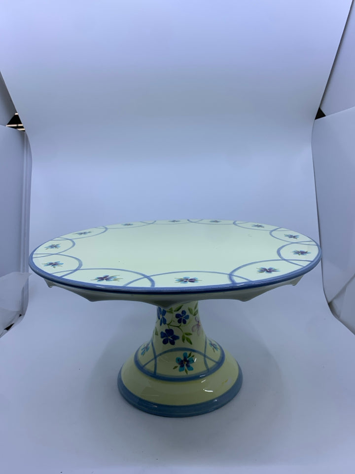 FOOTED CERAMIC YELLOW+BLUE CAKE STAND W/ FLOWERS.