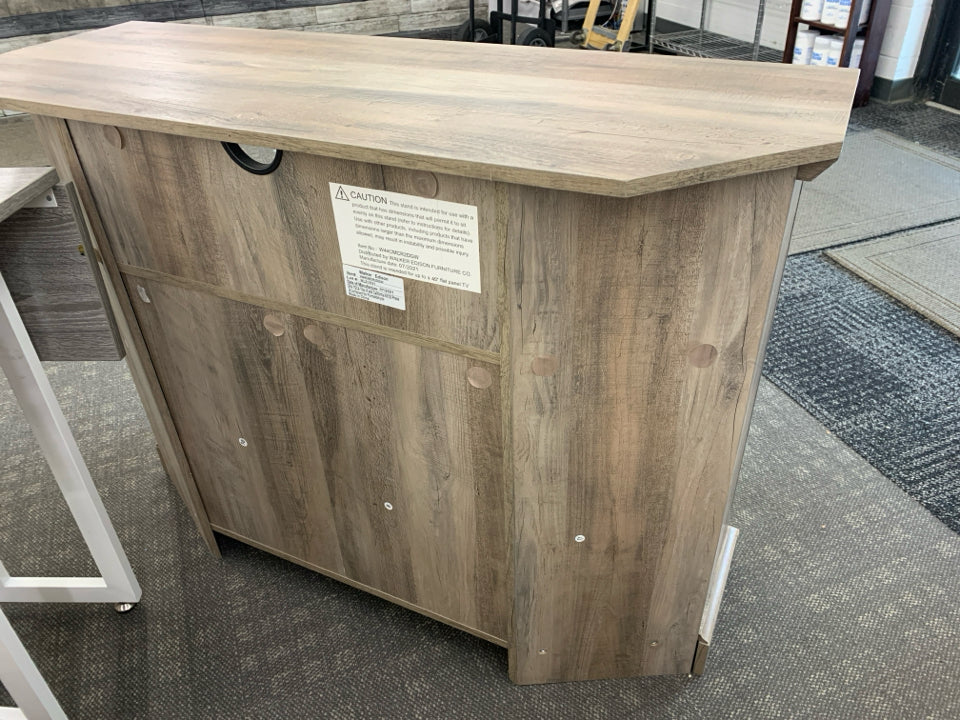 GREY CORNER TV STAND W CABINET ABD CUBBIE SHELF.