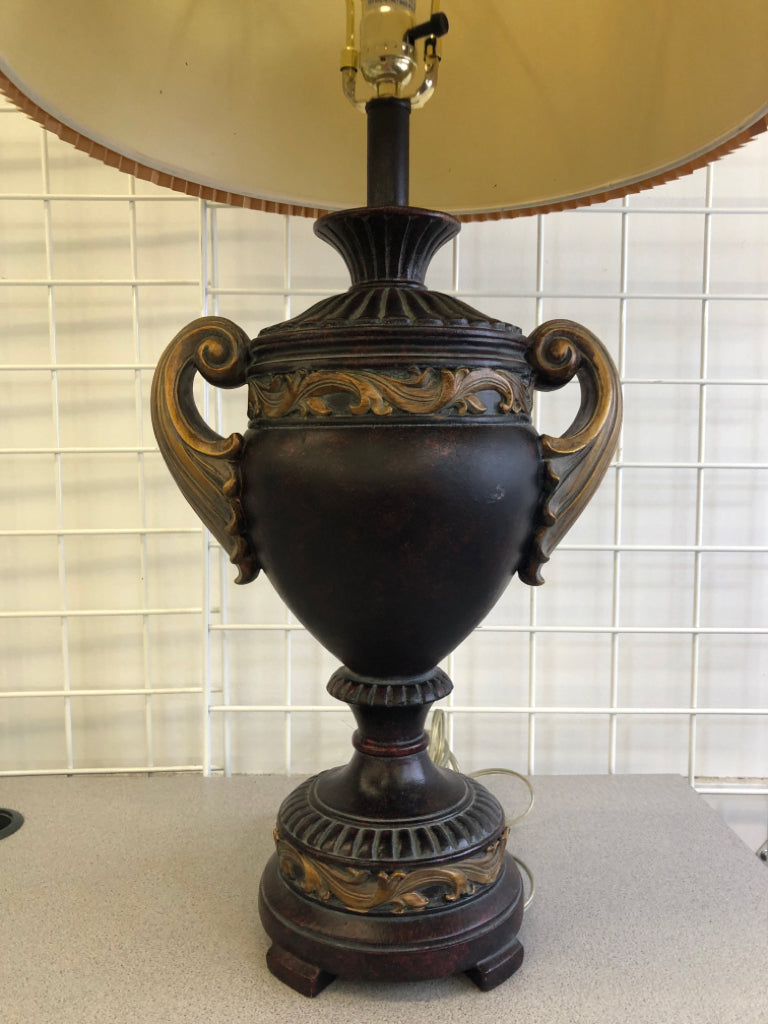BROWN/GOLD LEAF LAMP BASE W/TAN ACCORDION SHADE.