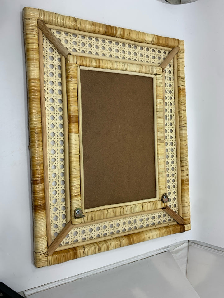 WOVEN RATTAN MIRROR.