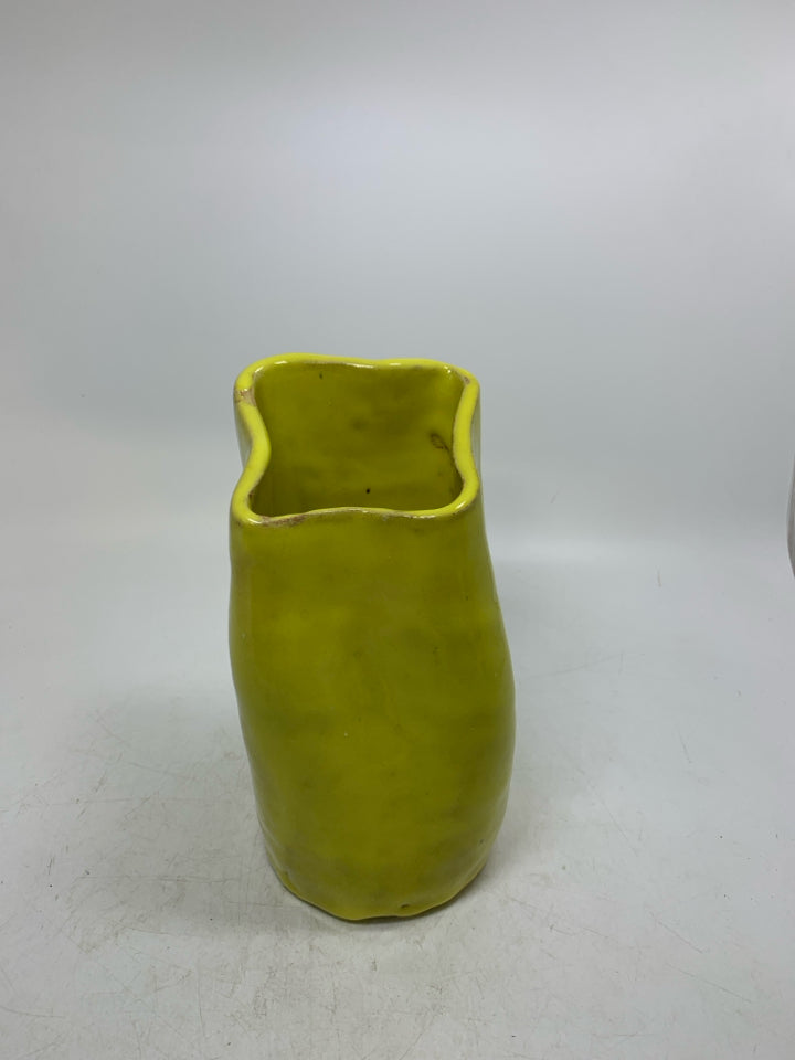 HEAVY UNEVEN POTTERY VASE.