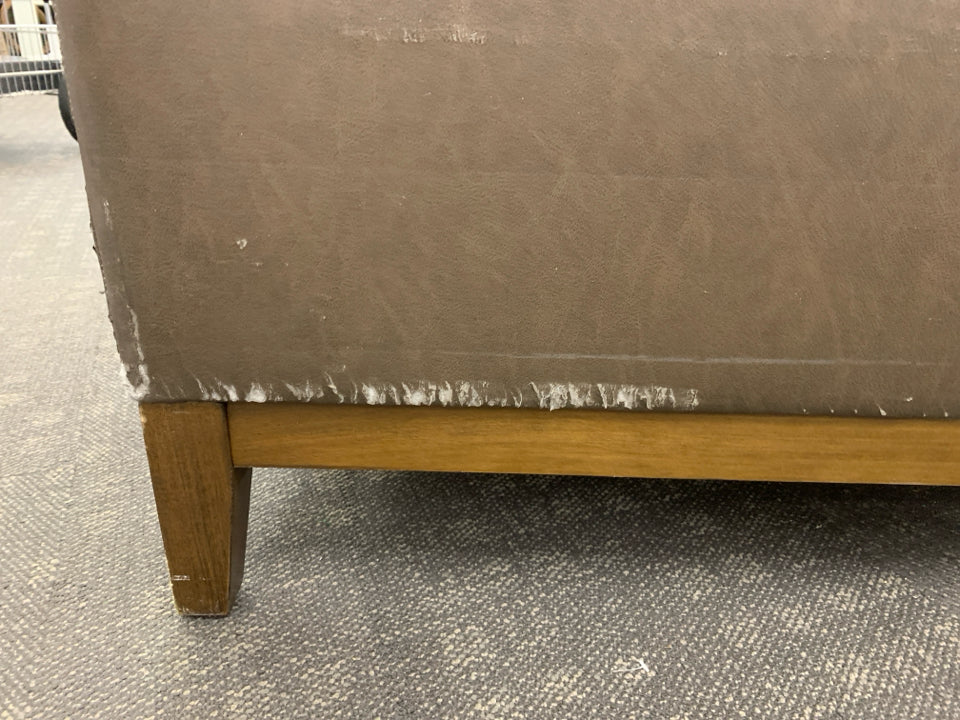 BROWN FAUX LEATHER COUCH.