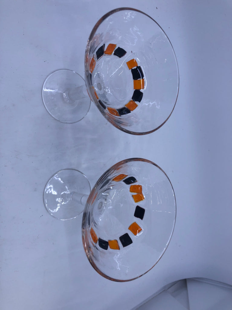 2 BLACK AND ORANGE MARTINI GLASSES.