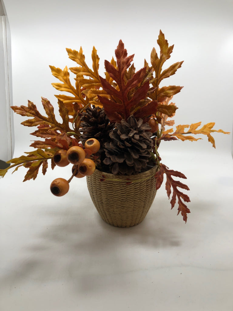 AUTUMN LEAVES/PINECONES IN WOVEN STONE VASE.