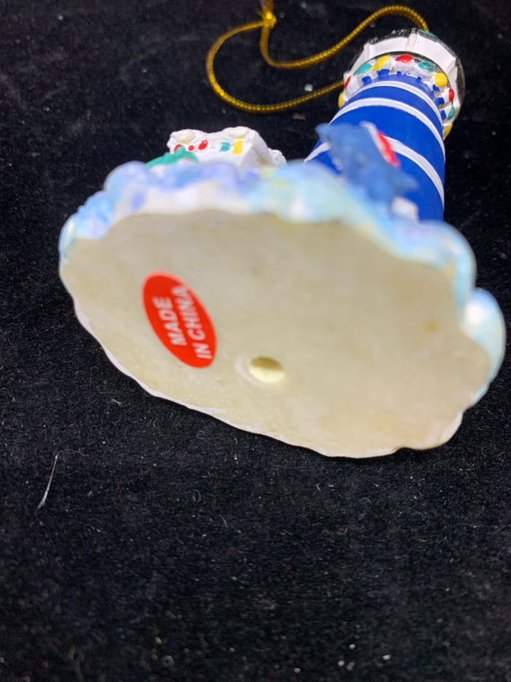 BLUE LIGHTHOUSE ORNAMENT W/SPYING SANTA.