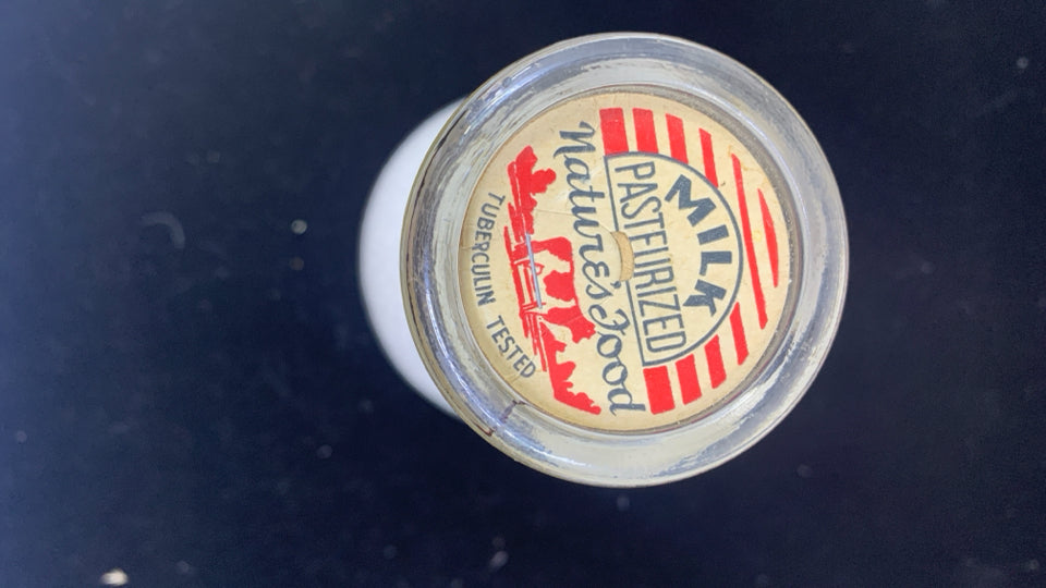 VTG MILK BOTTLE DUNN DAIRY W/ FILLER.