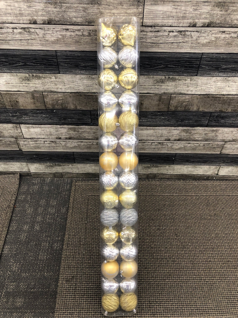 NIP SILVER GOLD PLASTIC ORNAMENTS.