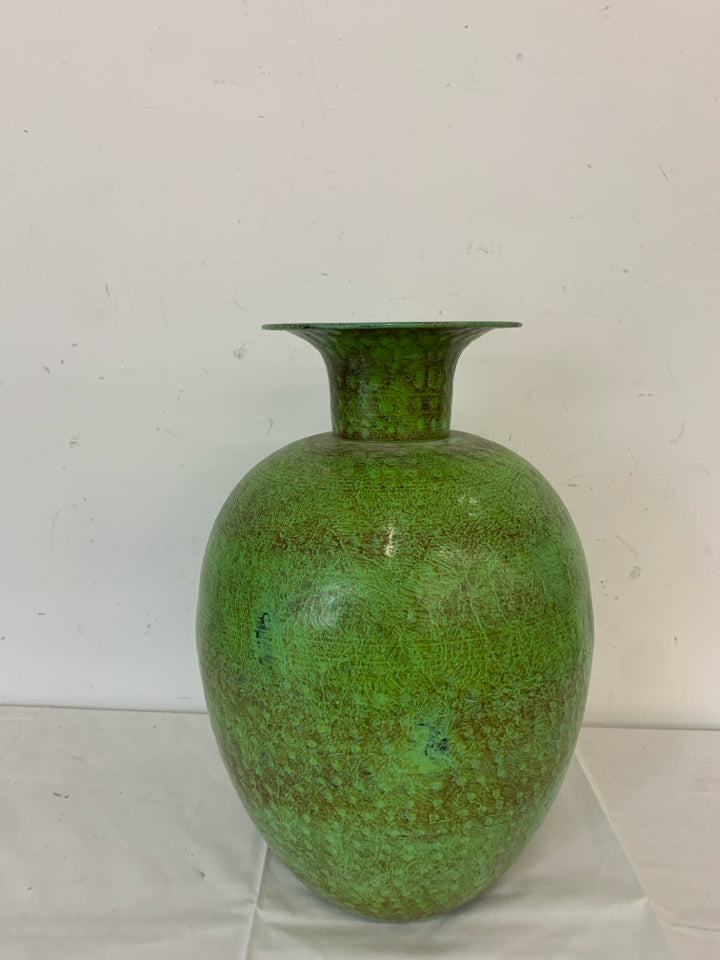 GREEN AND BROWN ROUND METAL VASE.