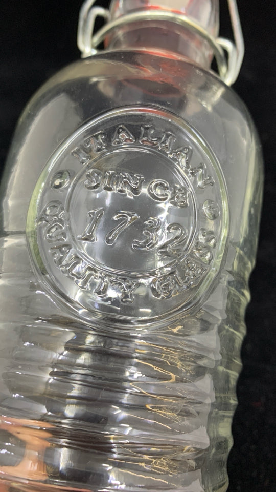 CLEAR RIBBED GLASS BOTTLE W/STOPPER.