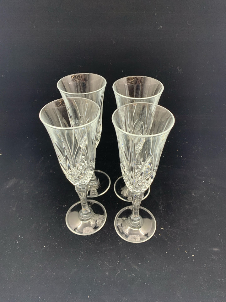 4 CUT GLASS CHAMPAGNE FLUTES.