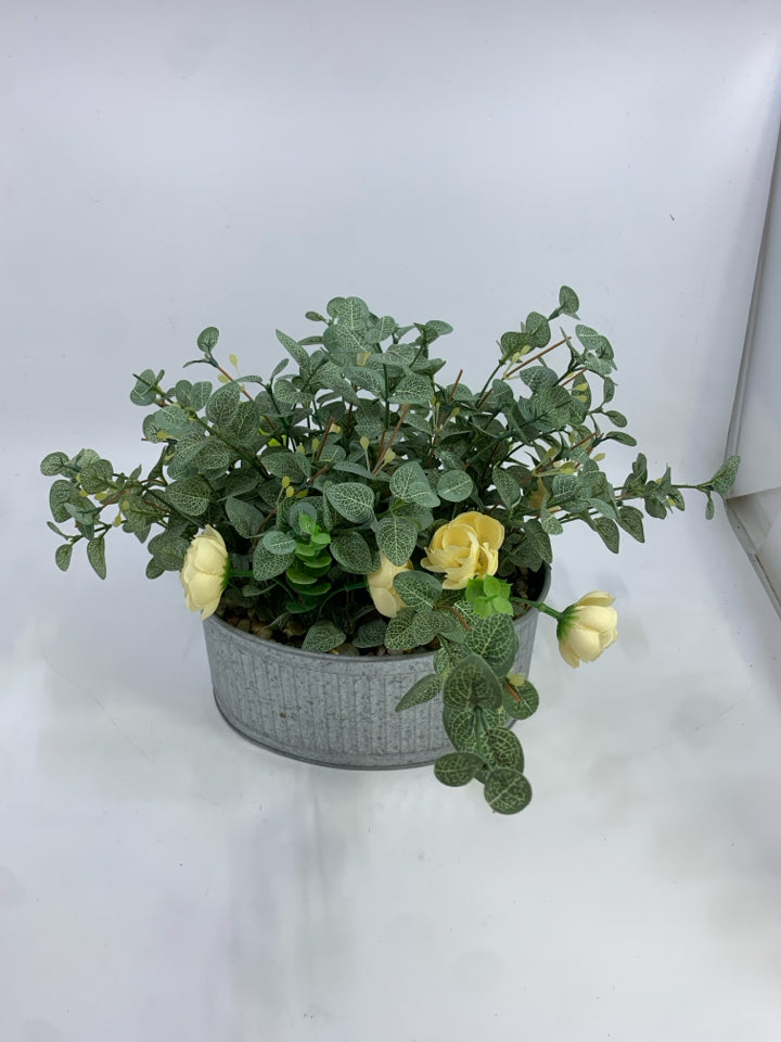 FAUX LEAVES & CREAM FLOWERS IN GALVANIZED TIN.