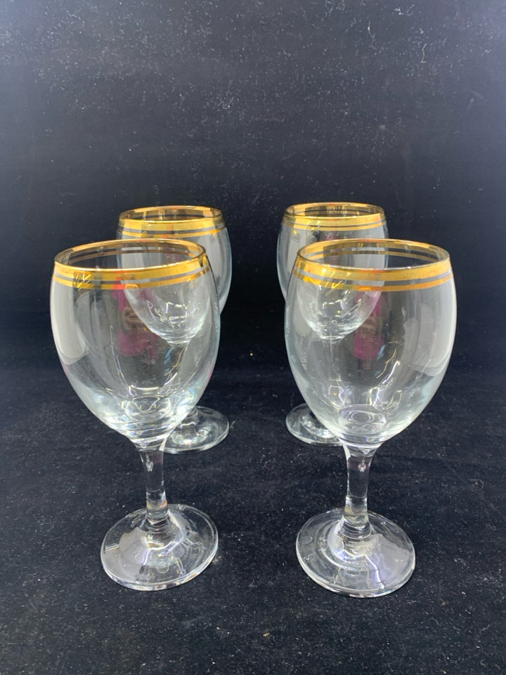 4 GOLD RIMMED WINE GLASSES.