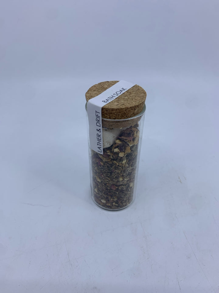 NIP LATHER AND DRIFT BATH SOAK.