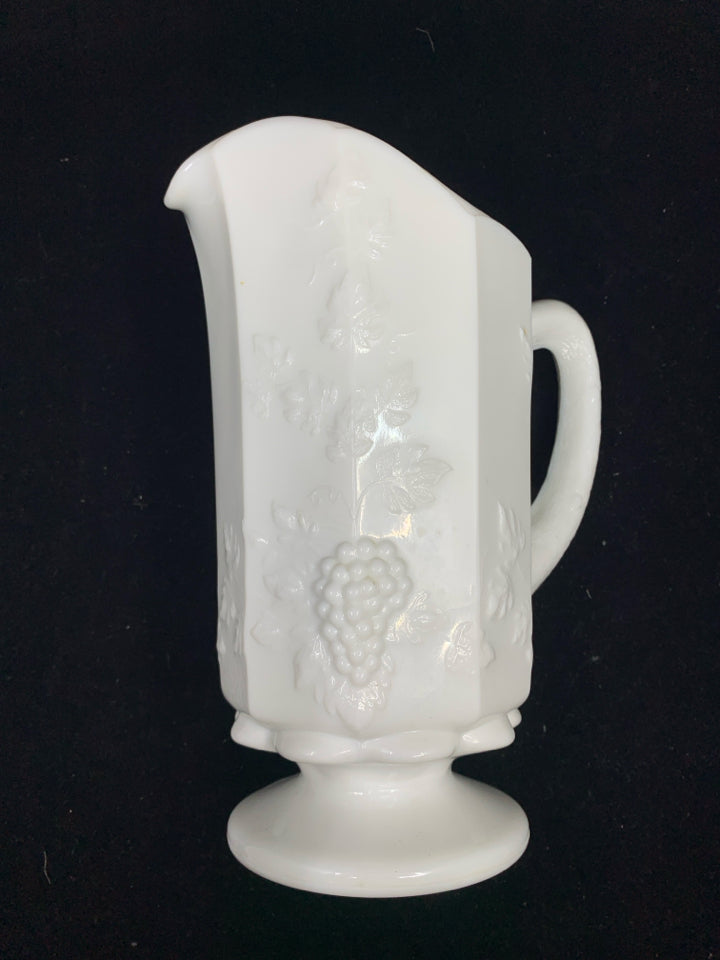 VTG MILK GLASS FOOTED PITCHER W/ EMBOSSED GRAPES +VINES.