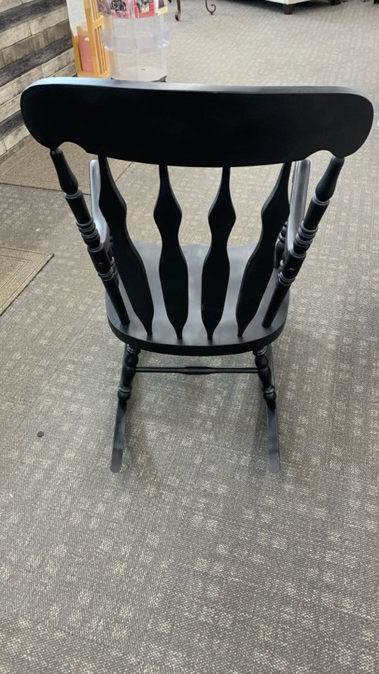 BLACK PAINTED WOOD ROCKING CHAIR.