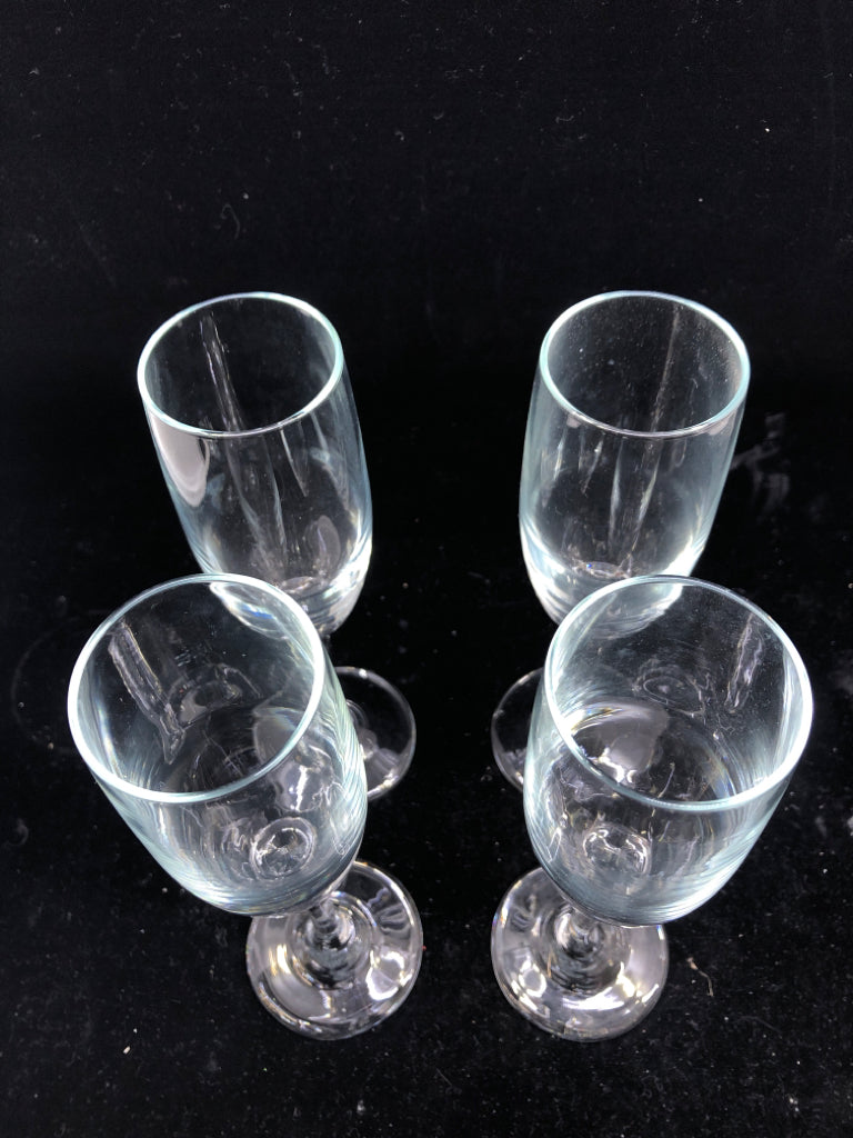 4 CLEAR CHAMPAGNE GLASSES.