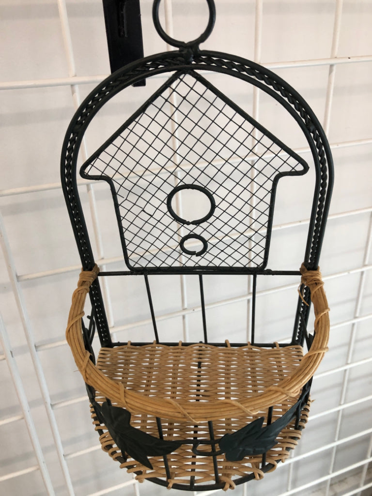 GREEN METAL SHELF W WICKER BASE.