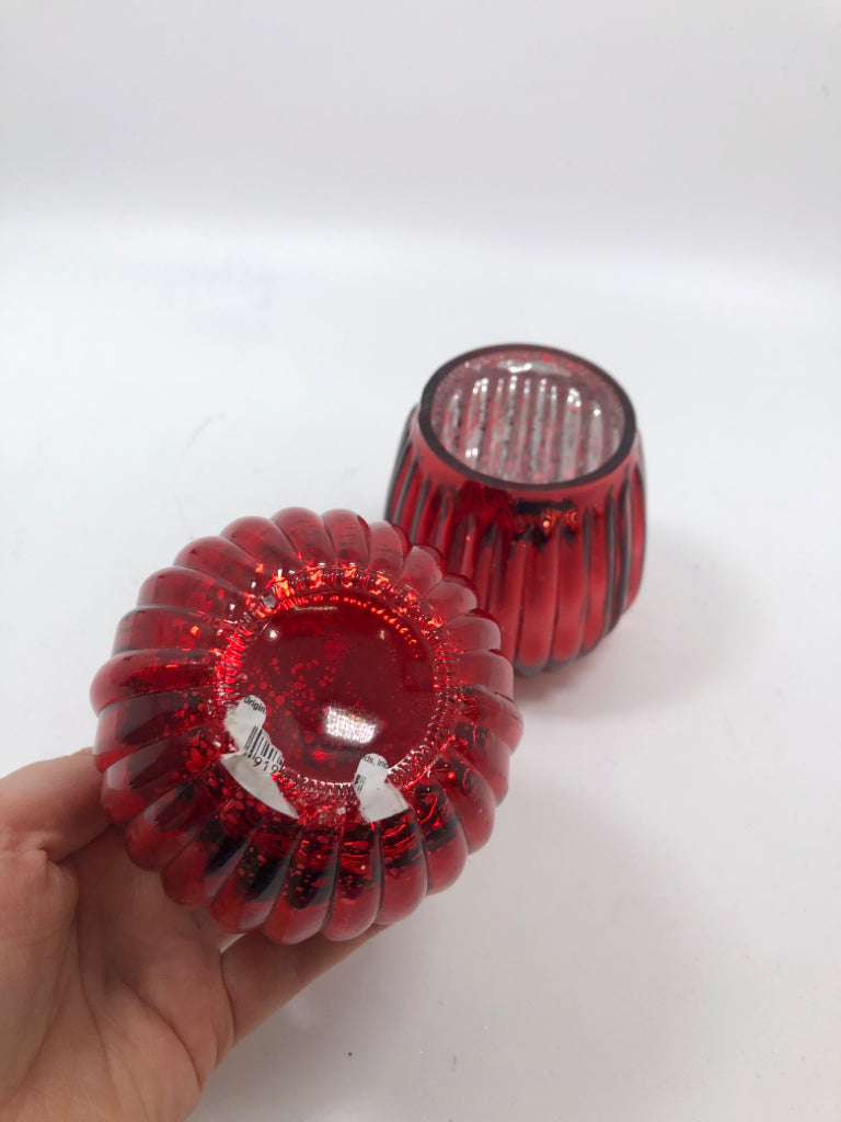 2 RED RIBBED GLASS TEALIGHT HOLDERS.