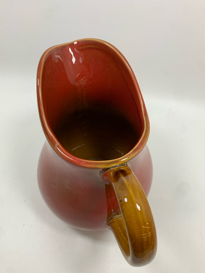 RED CERAMIC PITCHER.