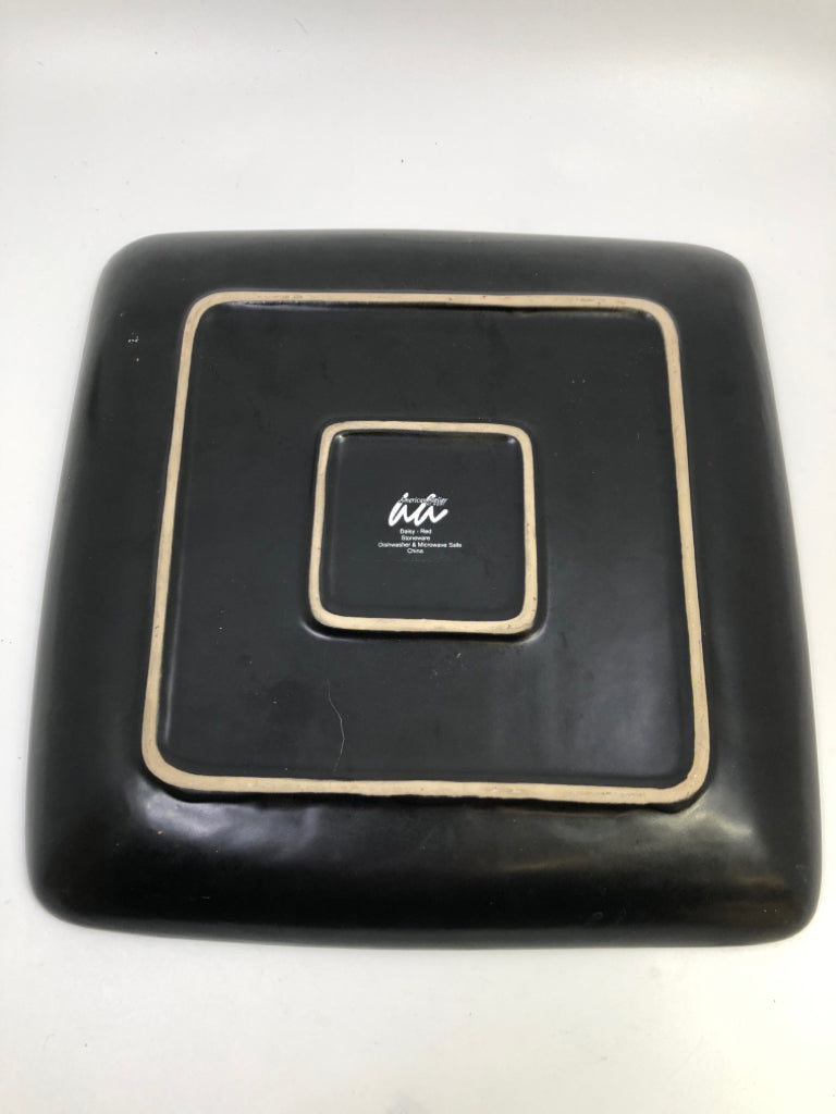 BLACK STONEWARE PLATE W/RED DAISY PATTERN.