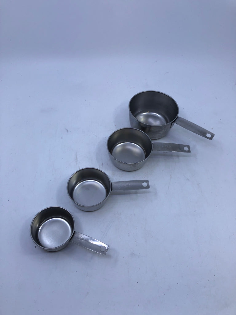 4 STACKING SILVER MEASURING CUPS.